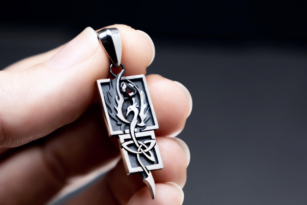 Sterling silver Phoenix pendant with garnet and Celtic knot