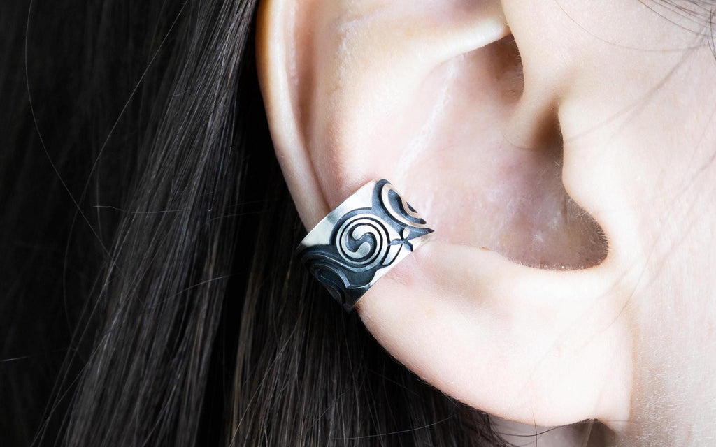 Celtic silver ear cuff worn on ear, no piercing design