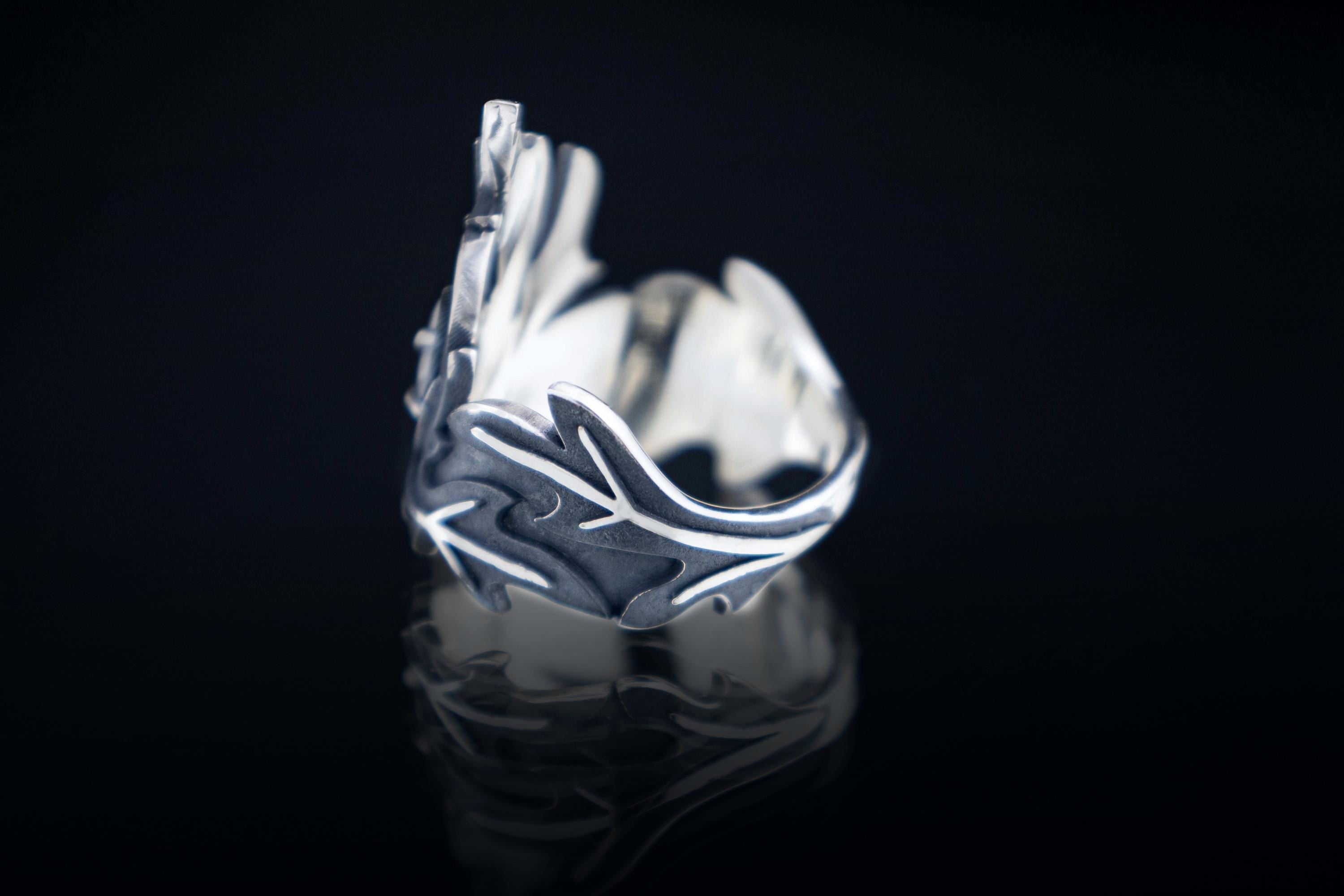 Asymmetrical sterling silver crown ring with marquise gemstone