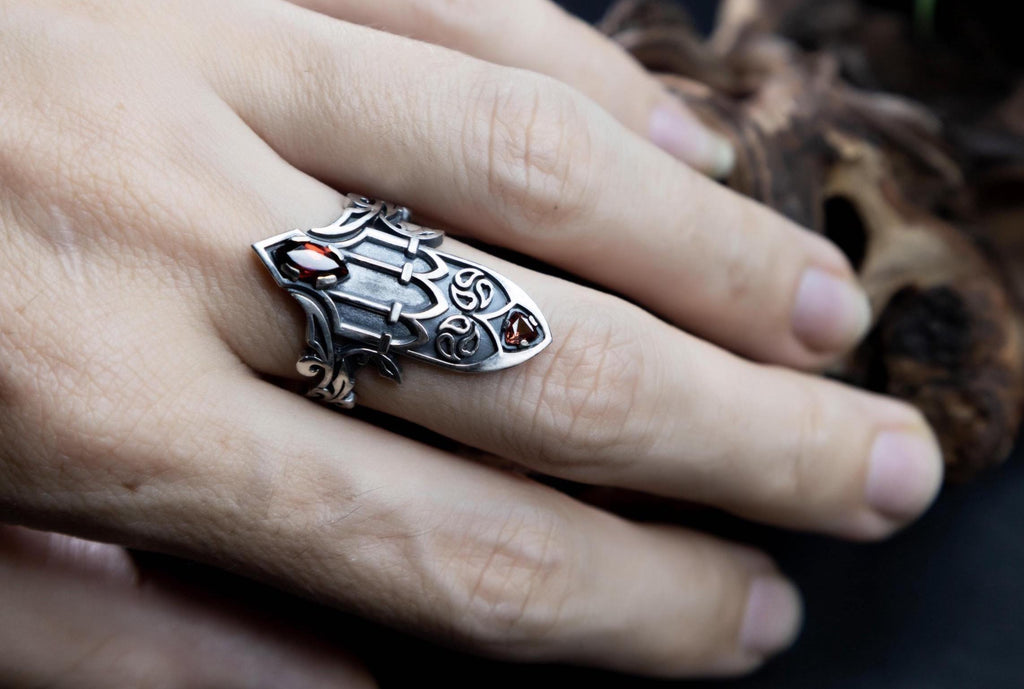 Medieval inspired silver ring with garnet on hand