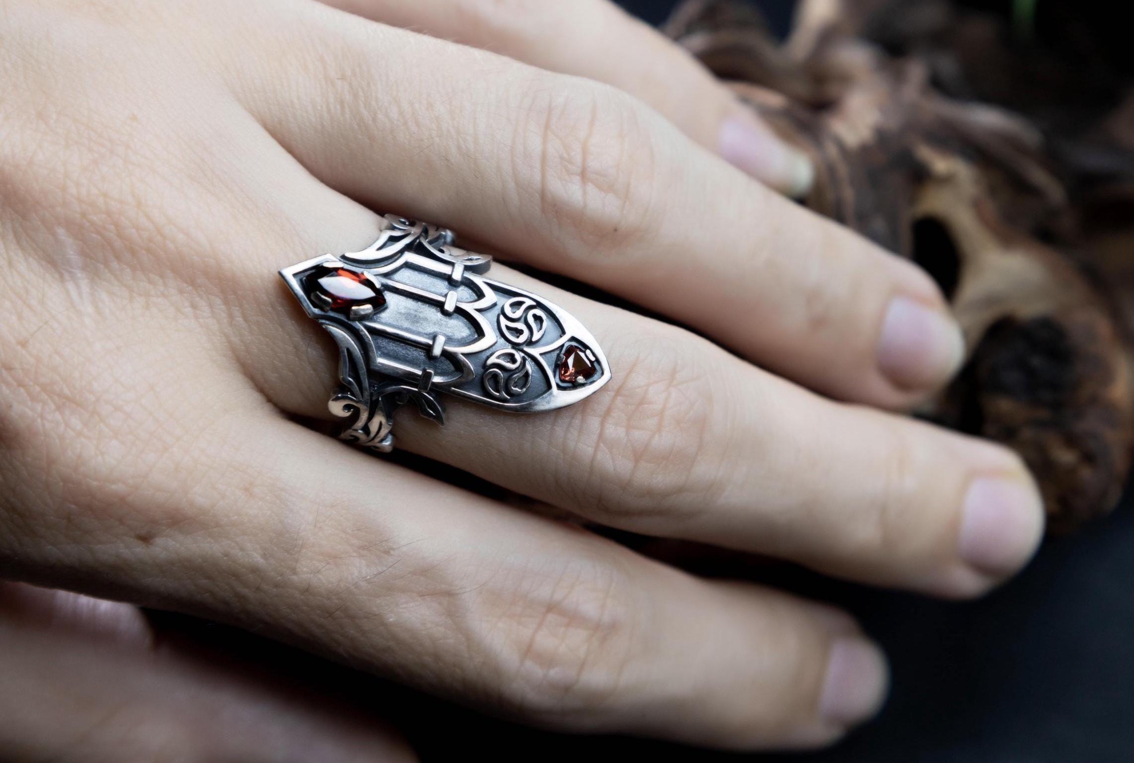 Medieval inspired silver ring with garnet on hand