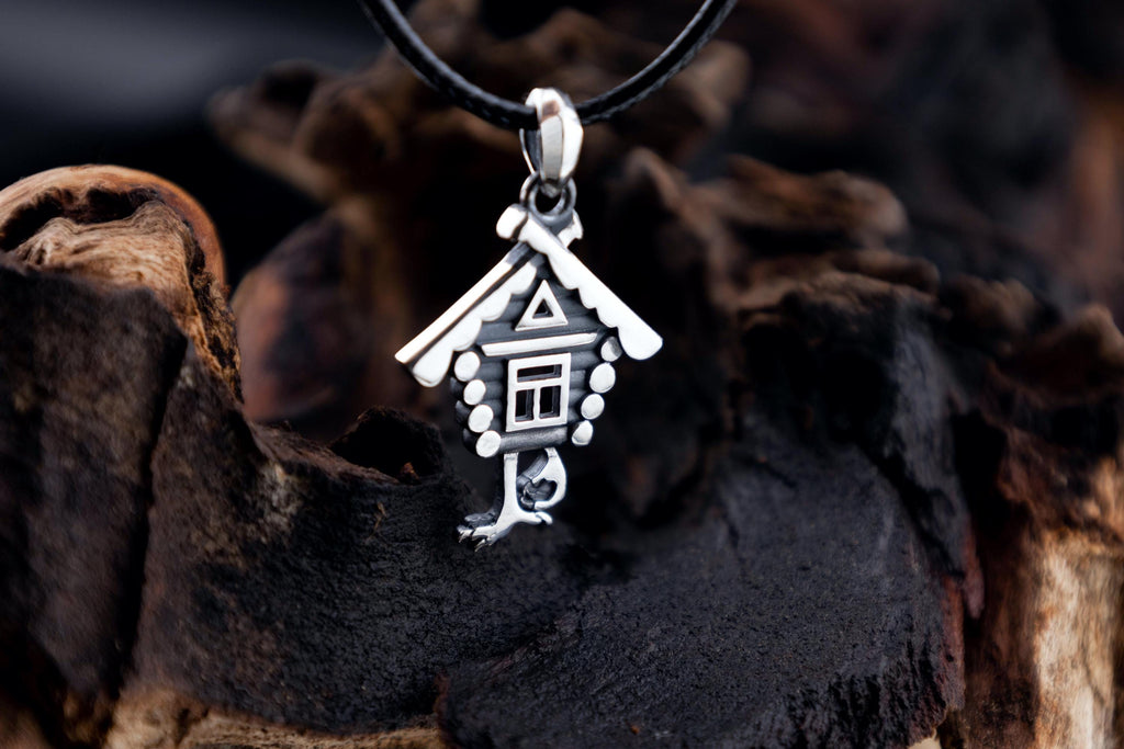 Detailed view of silver Slavic witch hut jewelry