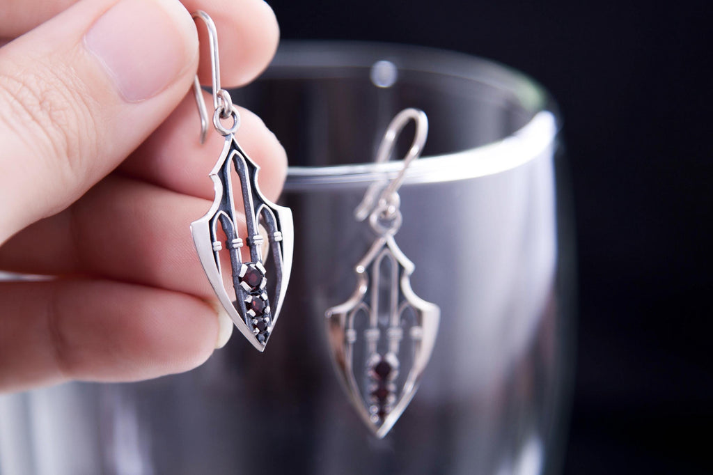 Gothic silver earrings with cathedral arches and three garnets