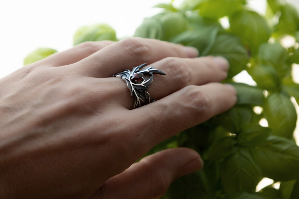 garnet marquise stone set in leaf-shaped silver ring