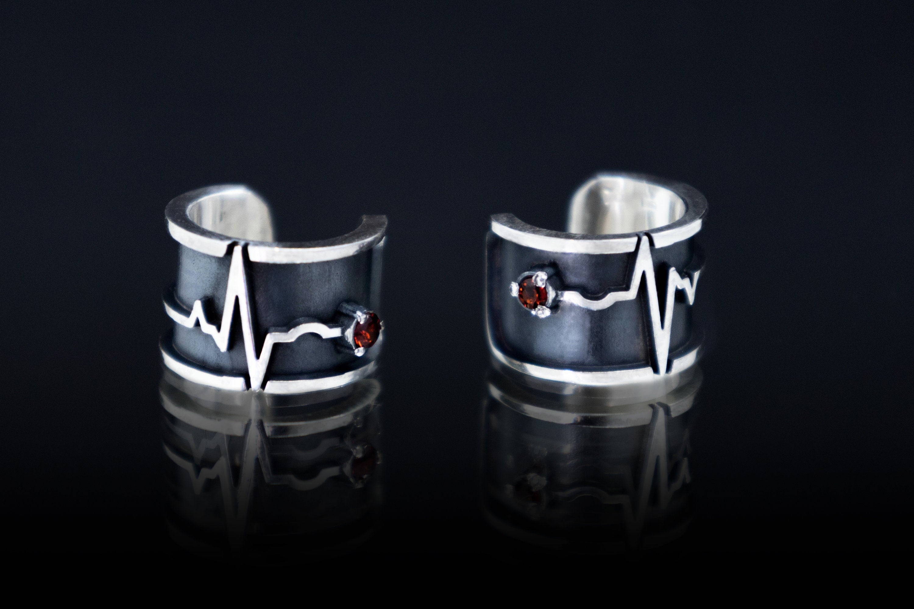 Sterling silver heartbeat ear cuffs with small garnet stone