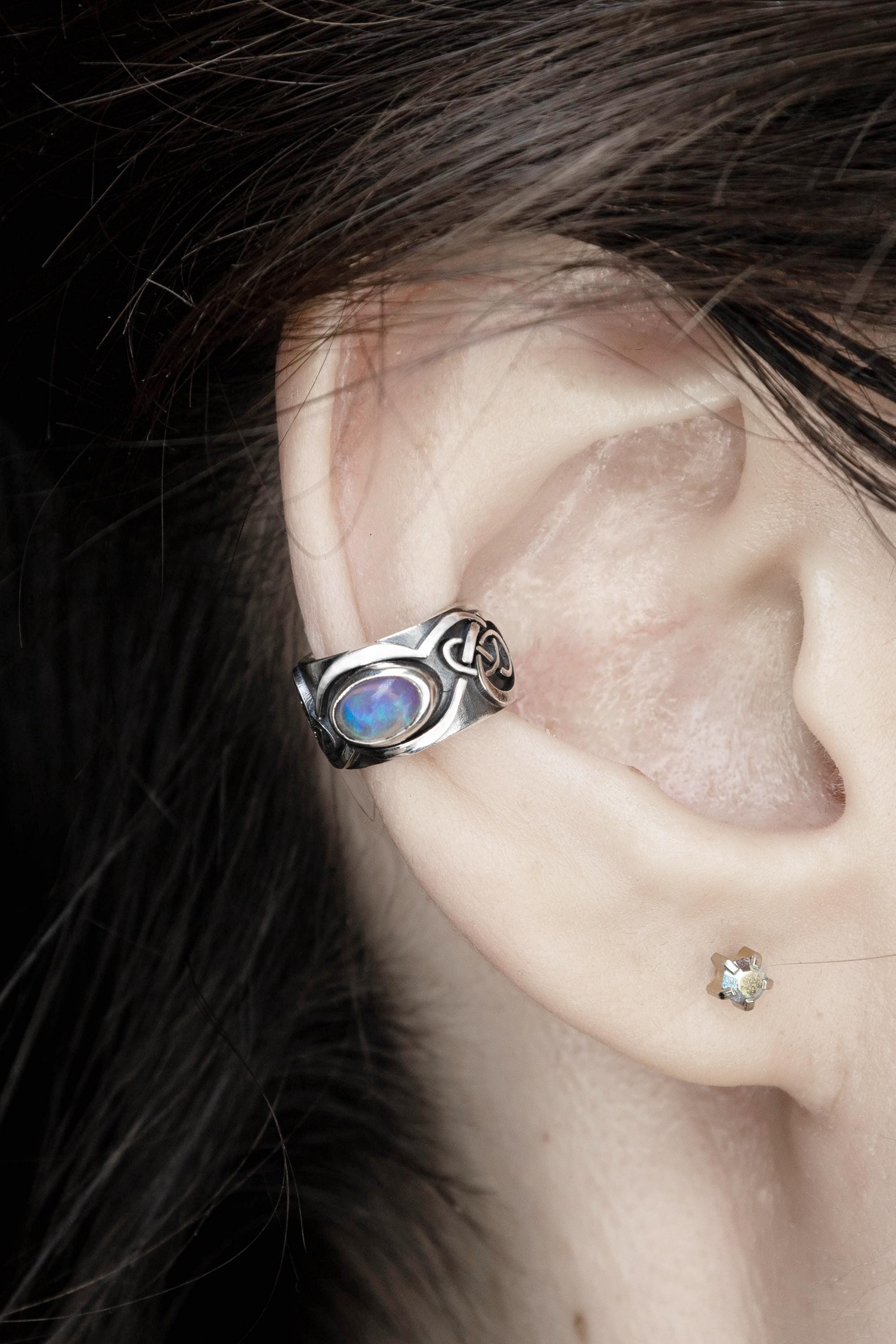 Wide opal ear cuff worn on ear