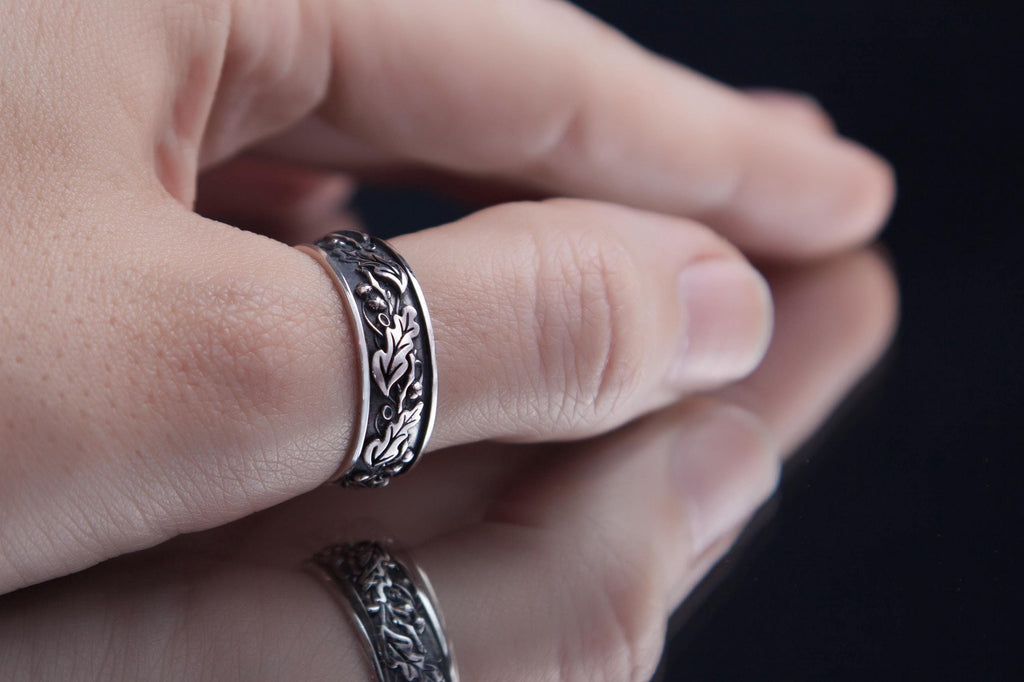 oak and acorn silver ring on hand
