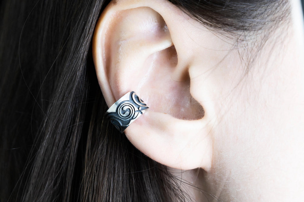 Handmade silver Celtic ear cuff shown on model