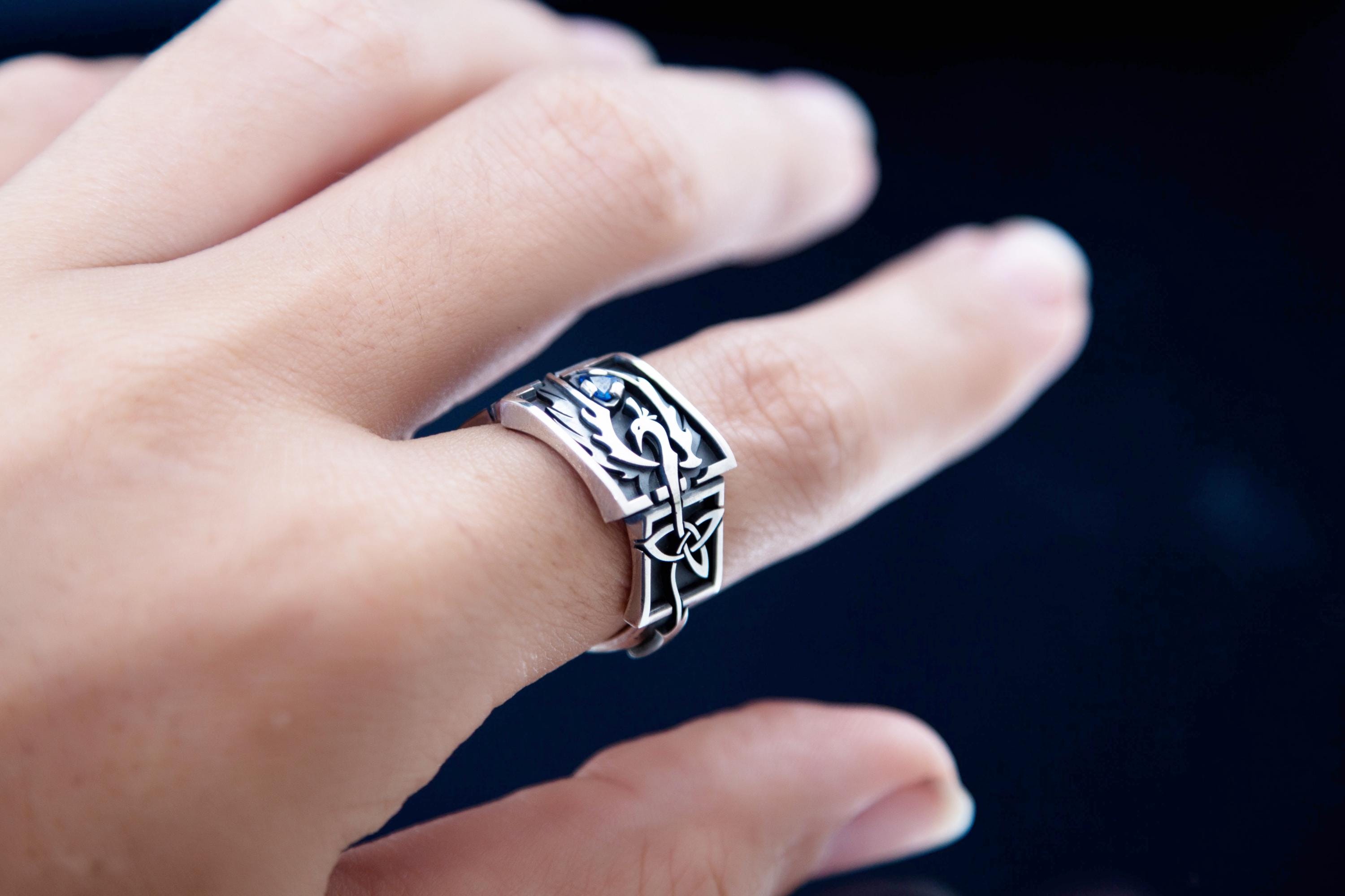 Handmade Celtic phoenix signet ring on hand