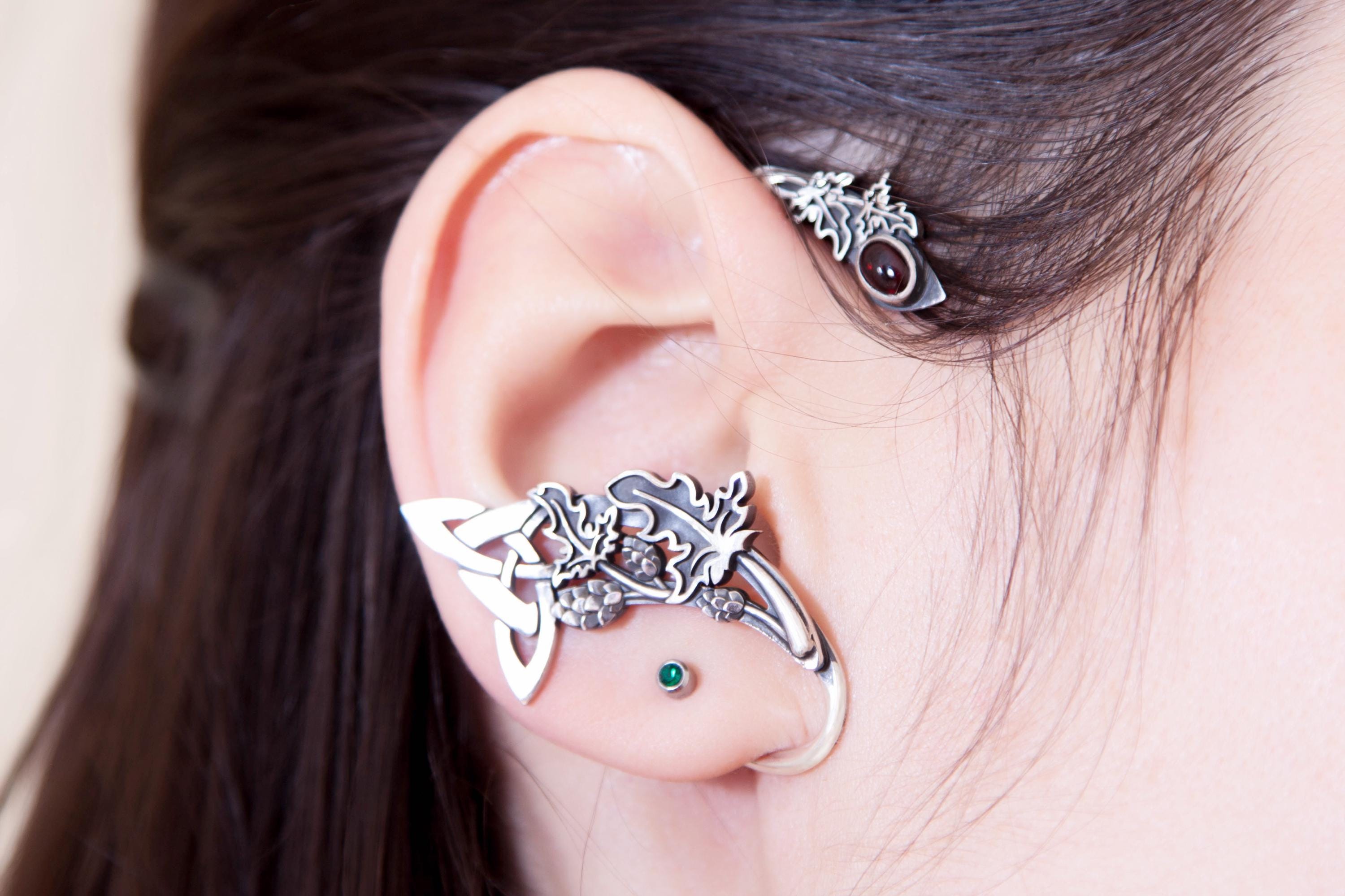Silver Celtic ear cuff with hop leaves worn on ear