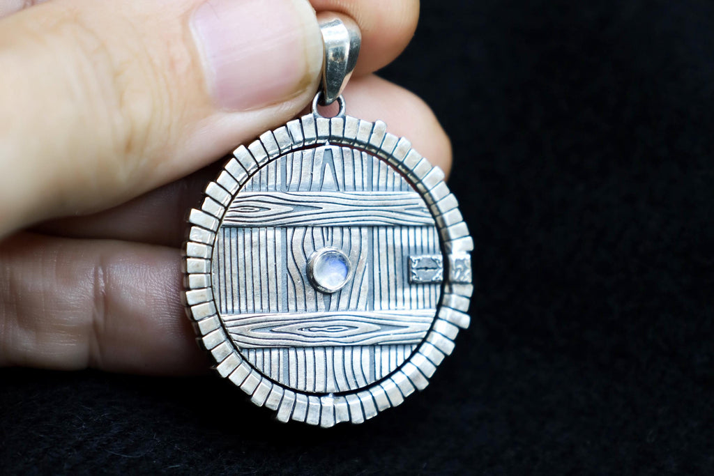 Spinning silver door pendant with moonstone fantasy inspired jewelry by DreamTower