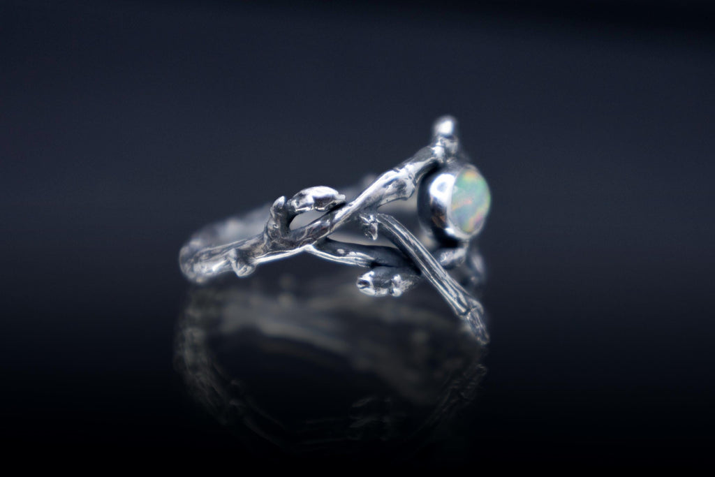 Handcrafted woodland twig ring shown from the side