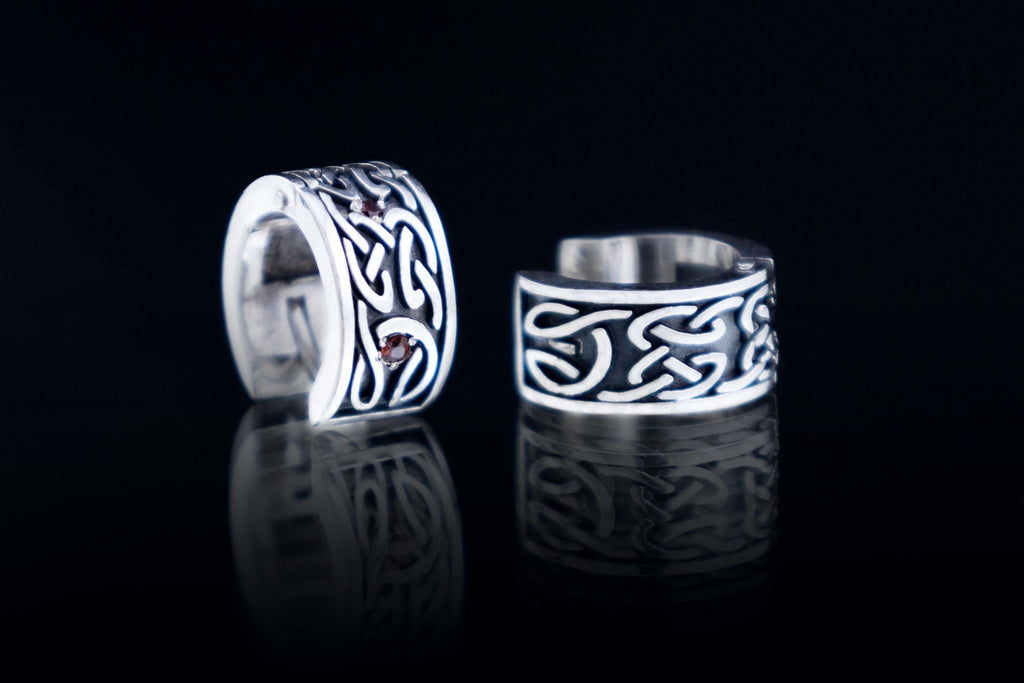 Celtic style silver hoop earring with detailed knot pattern