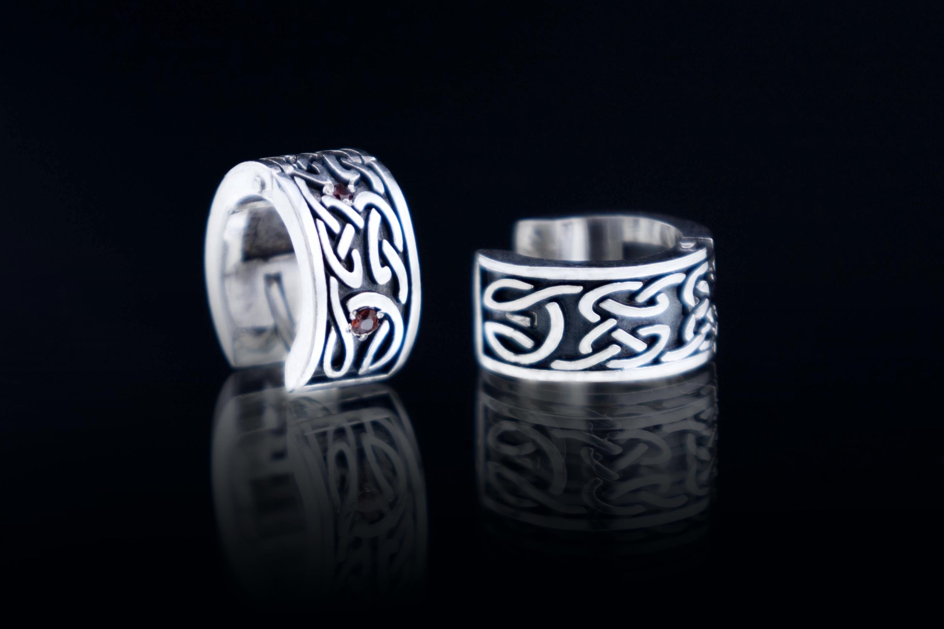 Celtic style silver hoop earring with detailed knot pattern