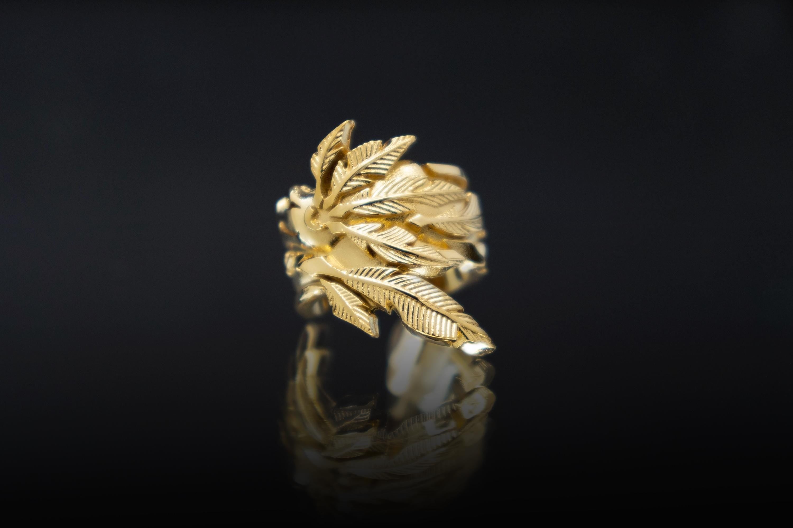 Feathered serpent ear cuff inspired by Aztec mythology