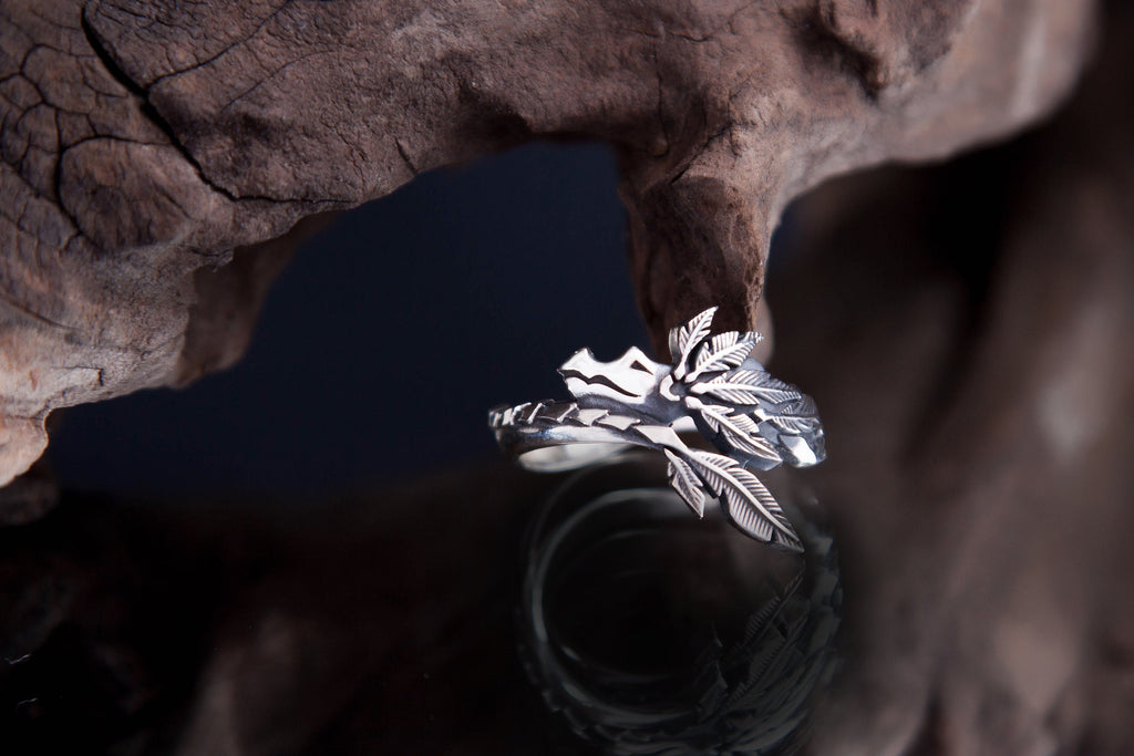 Handmade Mesoamerican inspired ring with textured feathers and serpent details