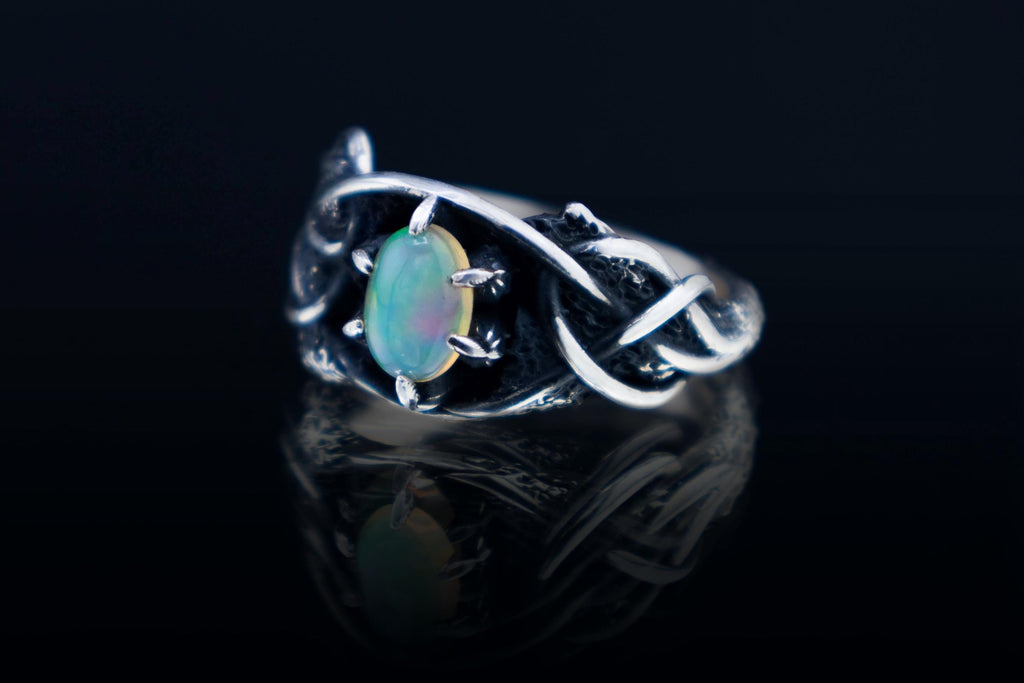 Sterling silver ring with Ethiopian opal and organic root texture