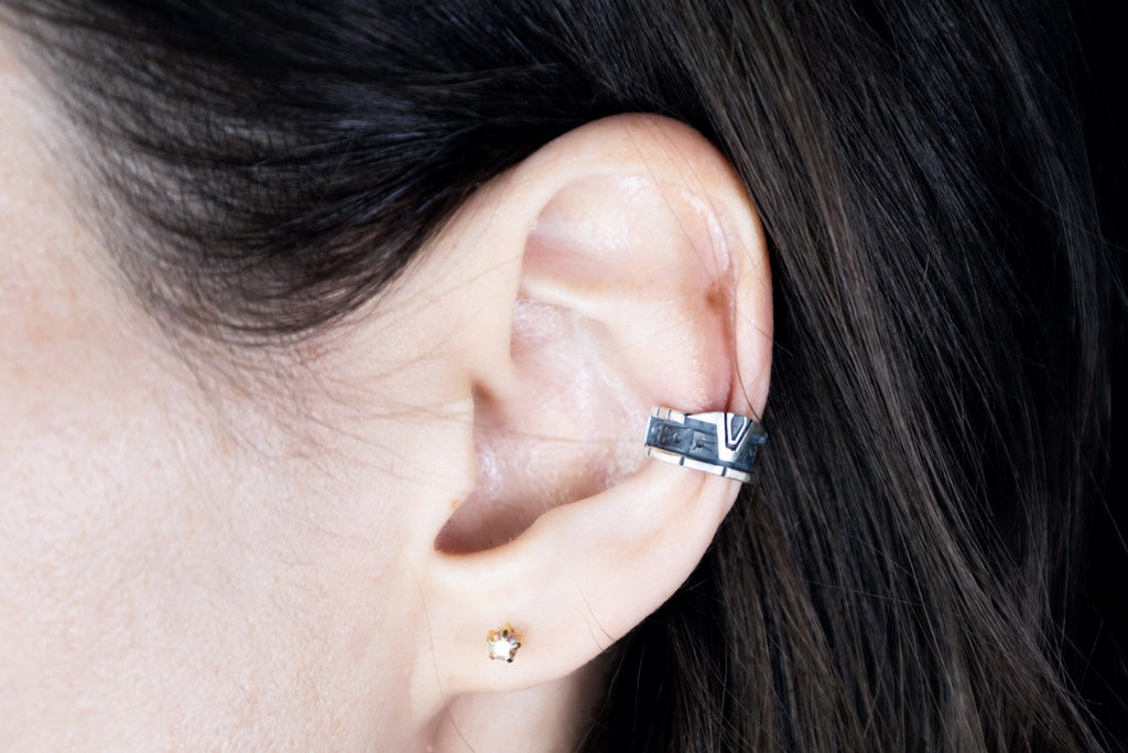 Silver Stargate ear cuff worn on ear