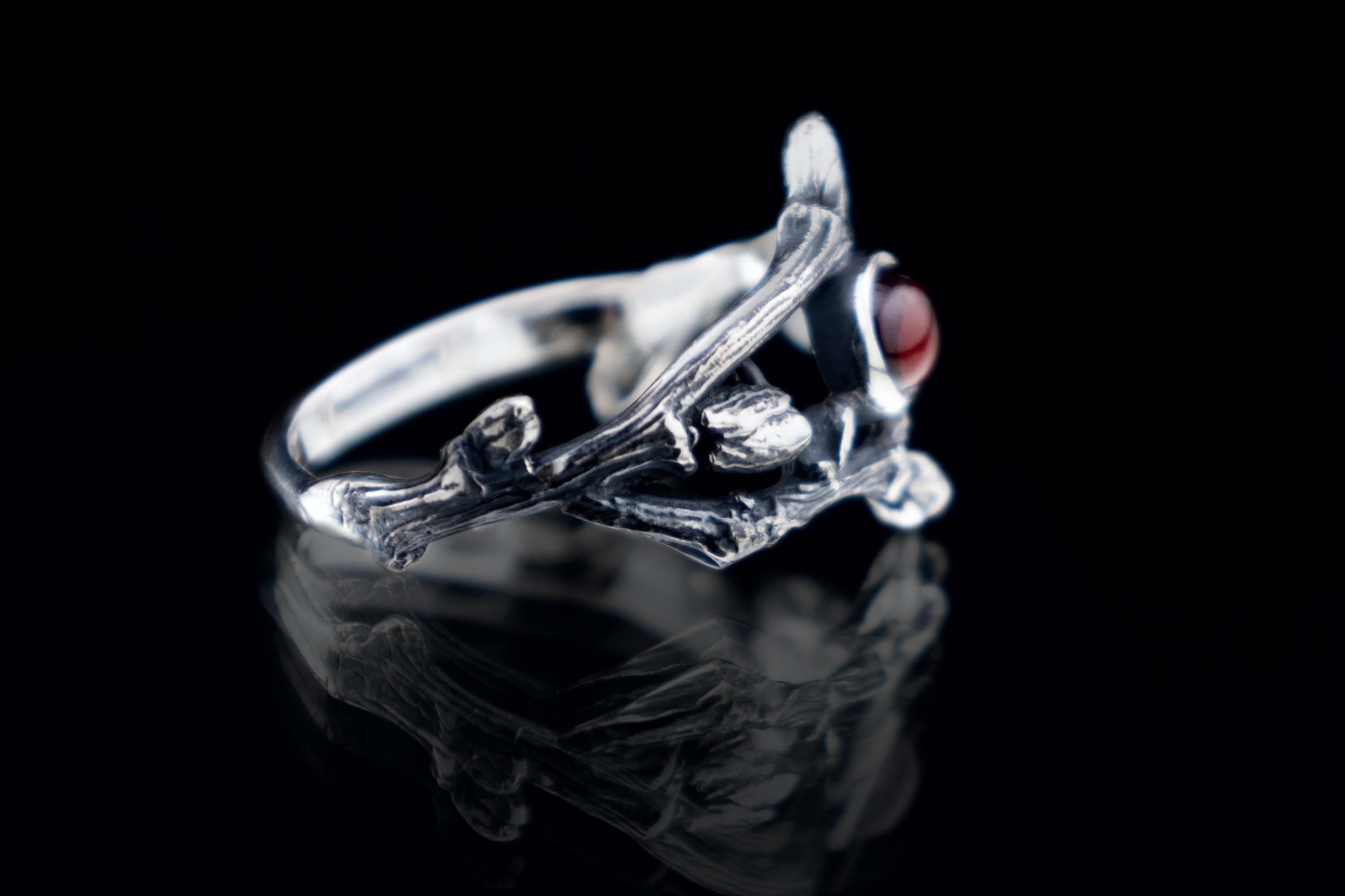 Sterling silver twig ring with deep red garnet cabochon