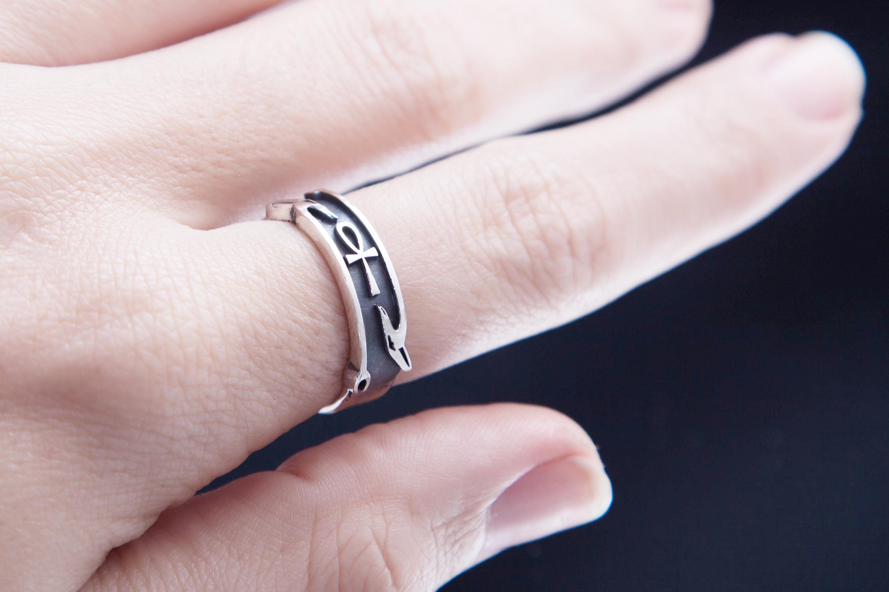 Egyptian symbol silver ring worn on hand, minimalist shot