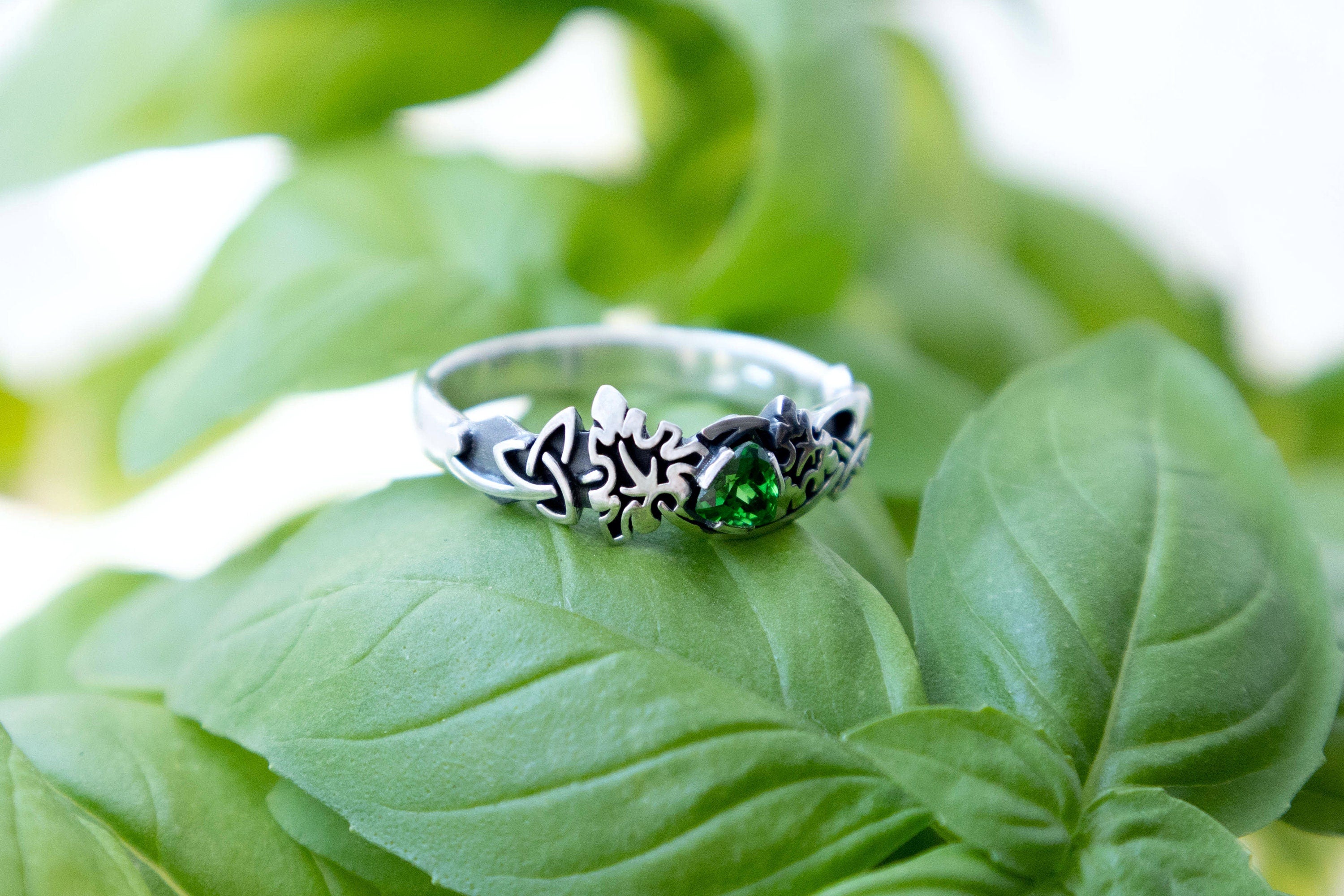 Sterling silver ivy ring with green stone on a leaf