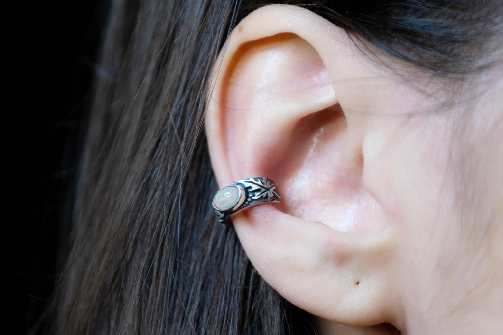 Sterling silver ear cuff worn on ear, grape leaf design