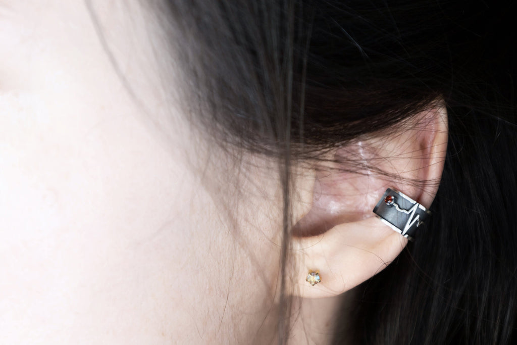 No piercing heartbeat ear cuff worn on ear