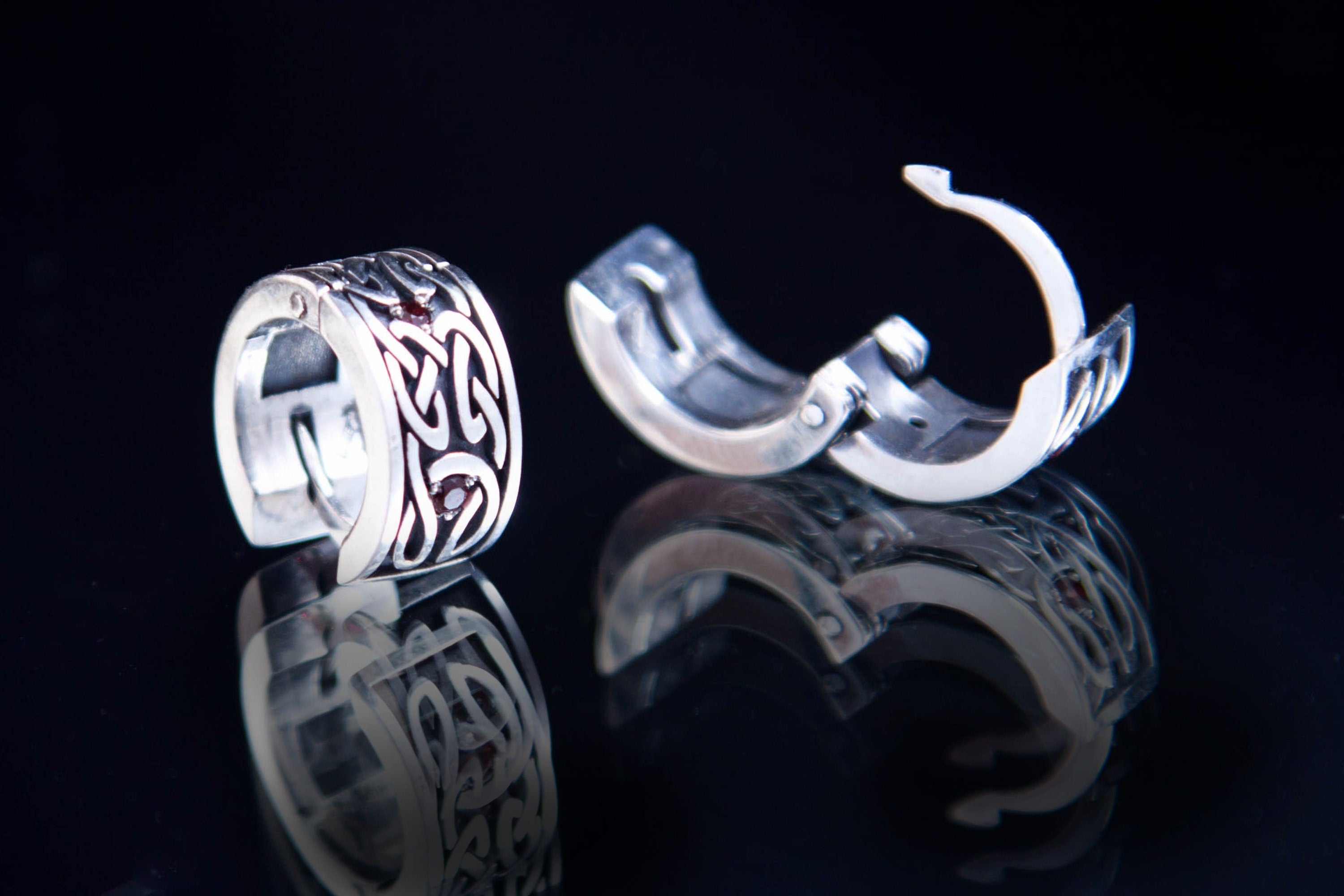 Silver Celtic huggies with garnet stones