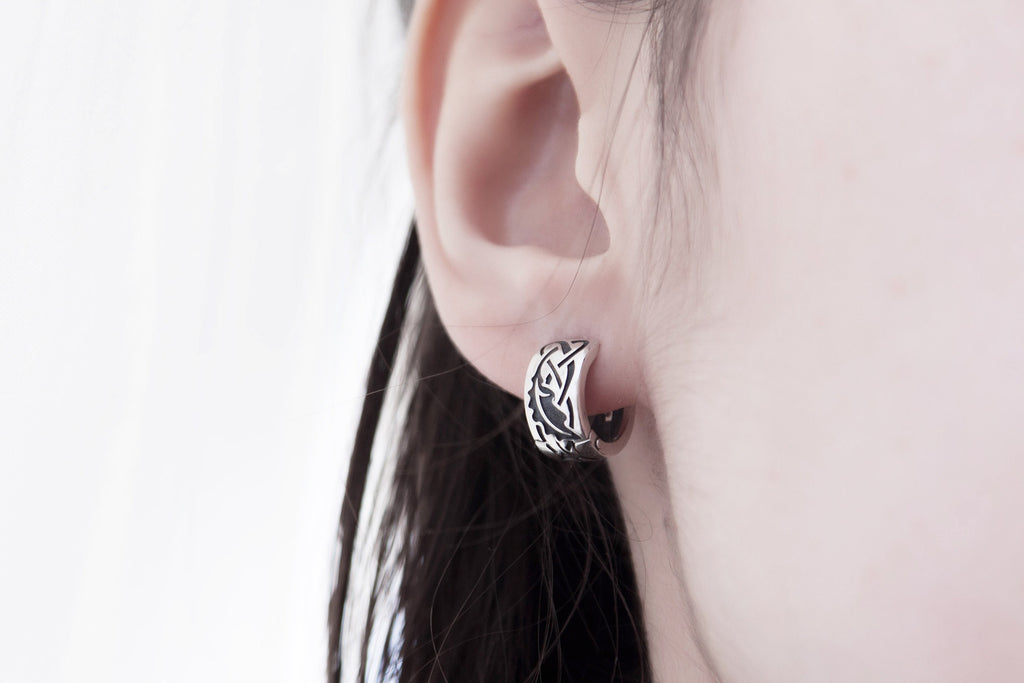 Sterling silver oak leaf earrings on model