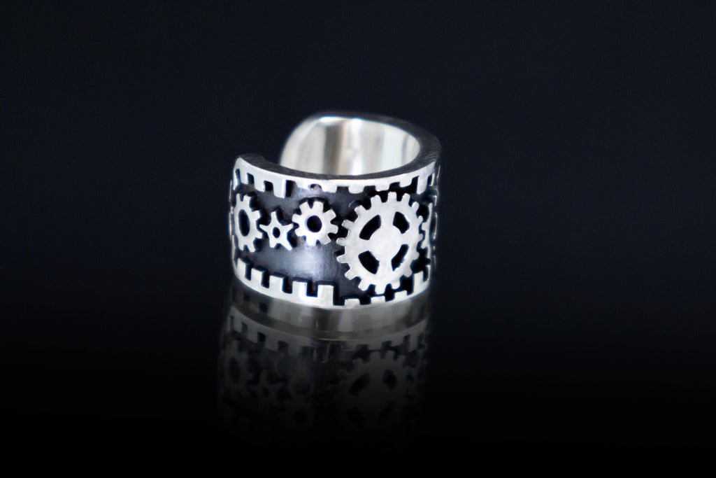 Close up of mechanical gear pattern ear cuff