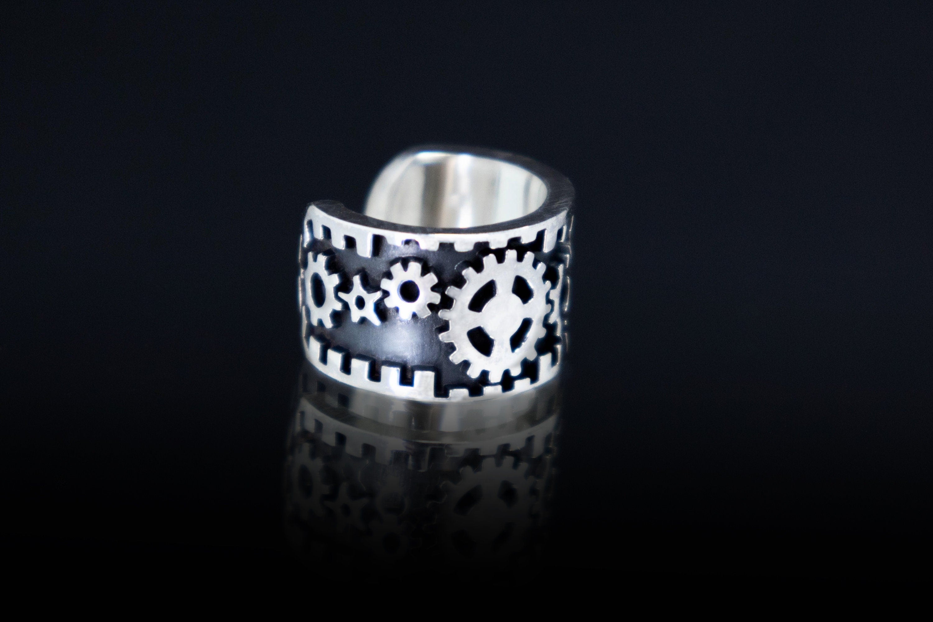 Close up of mechanical gear pattern ear cuff