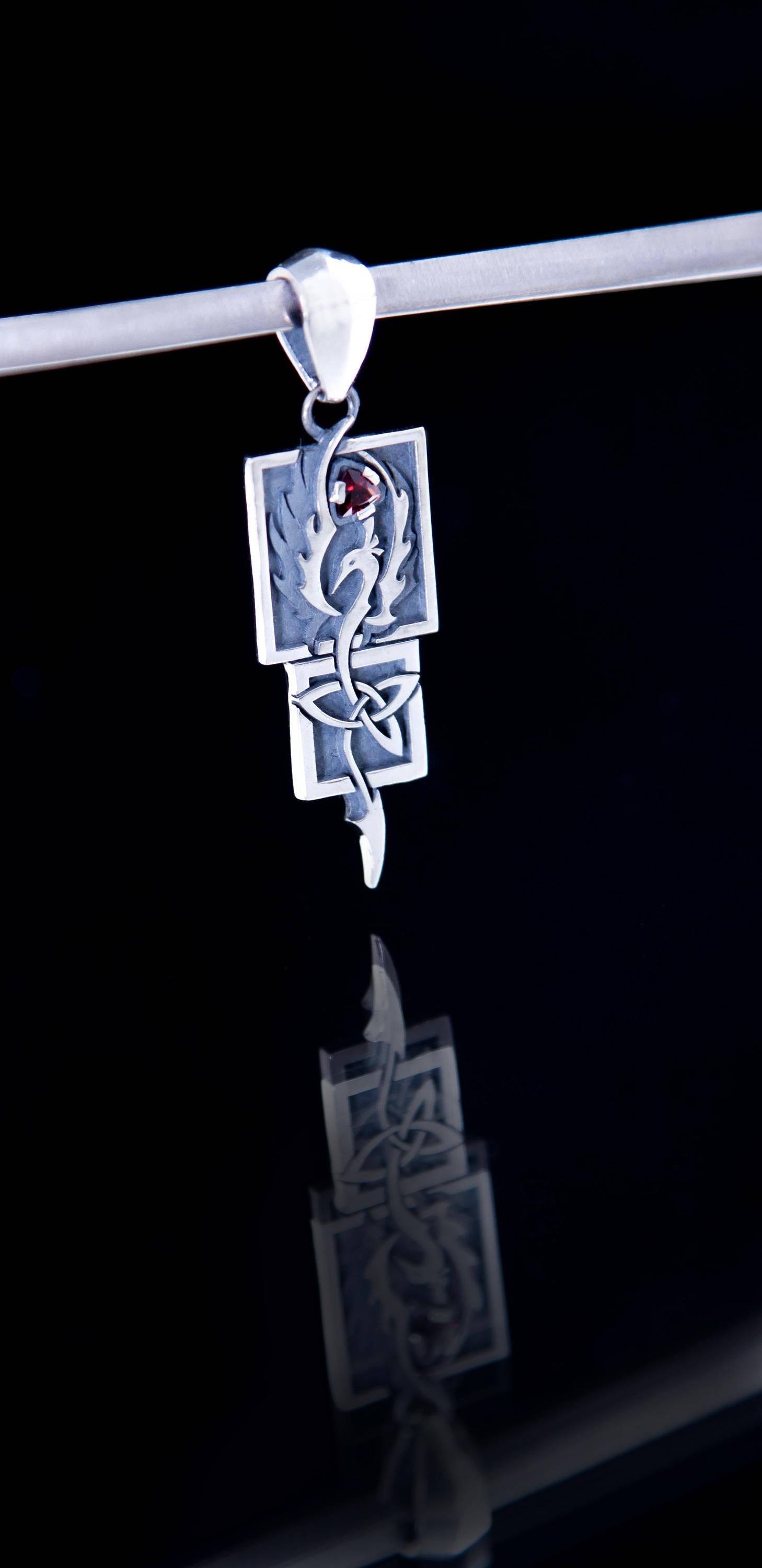 Magic garnet Phoenix charm in sterling silver