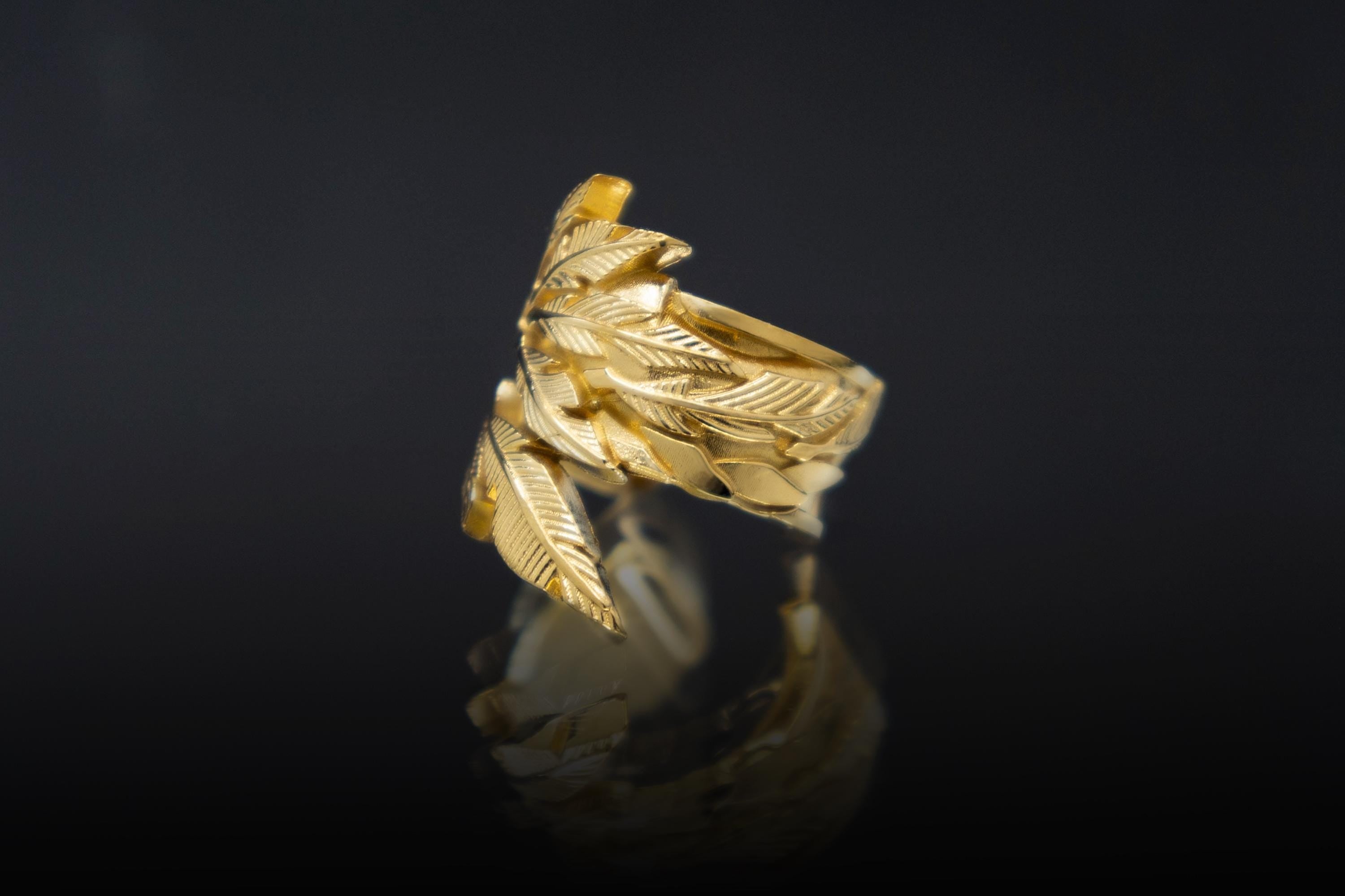 Feathered serpent ear cuff inspired by Aztec mythology