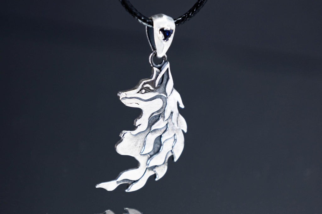 Sterling silver fox pendant with blue cubic zirconia