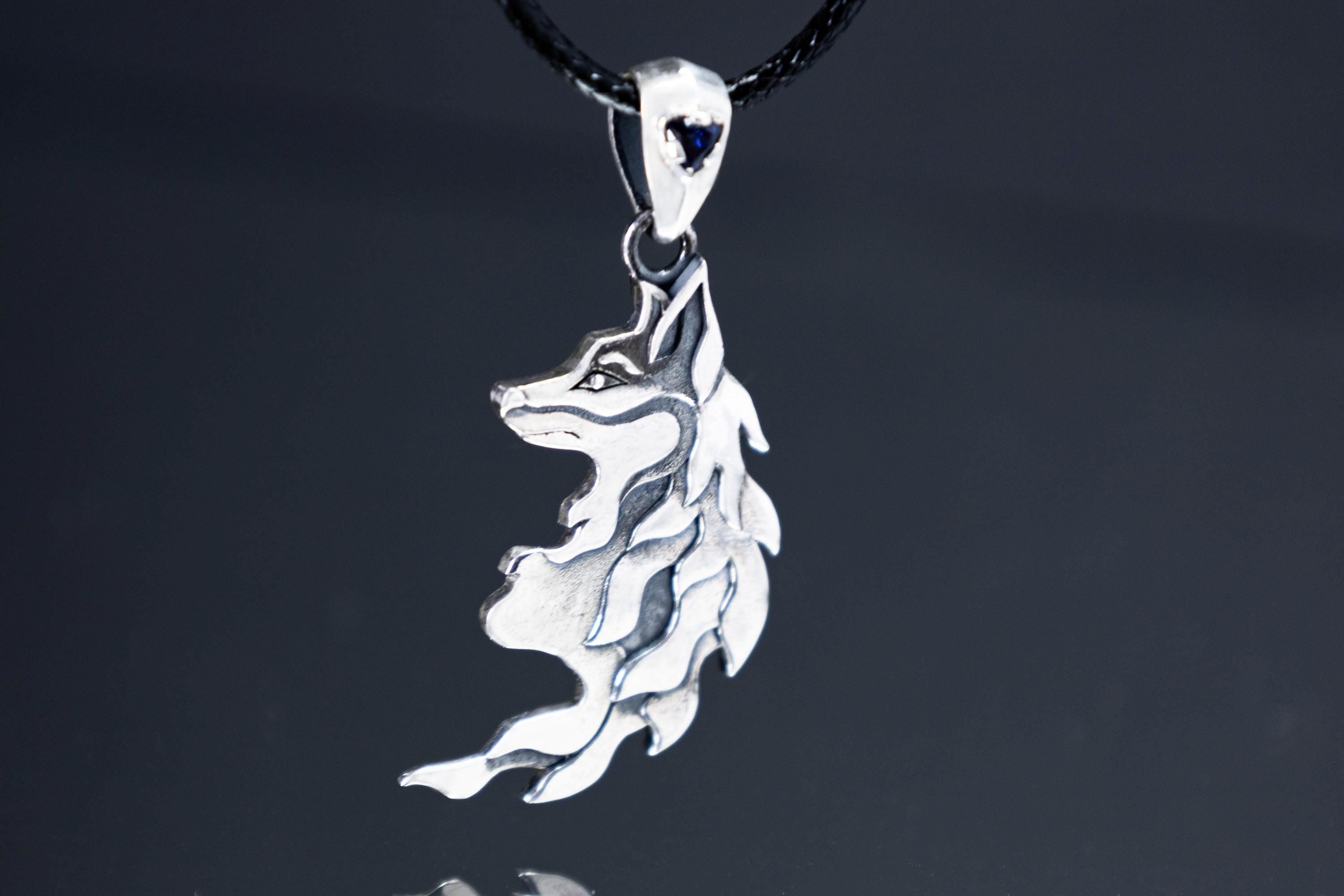 Sterling silver fox pendant with blue cubic zirconia