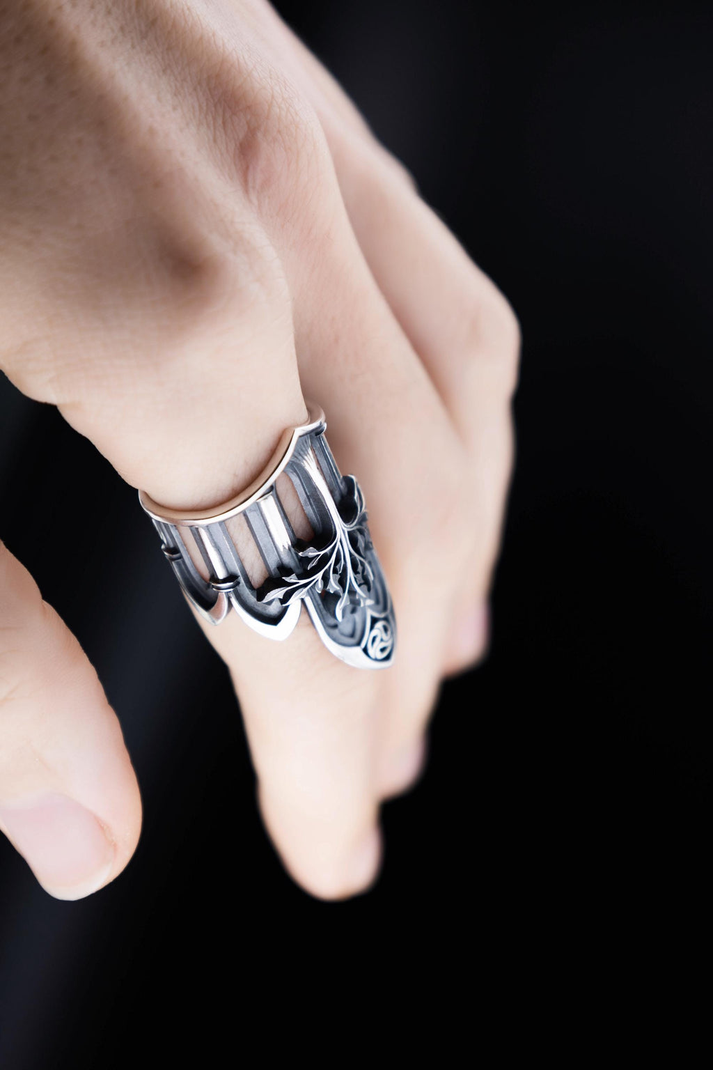 Hand wearing elven style sterling silver statement ring