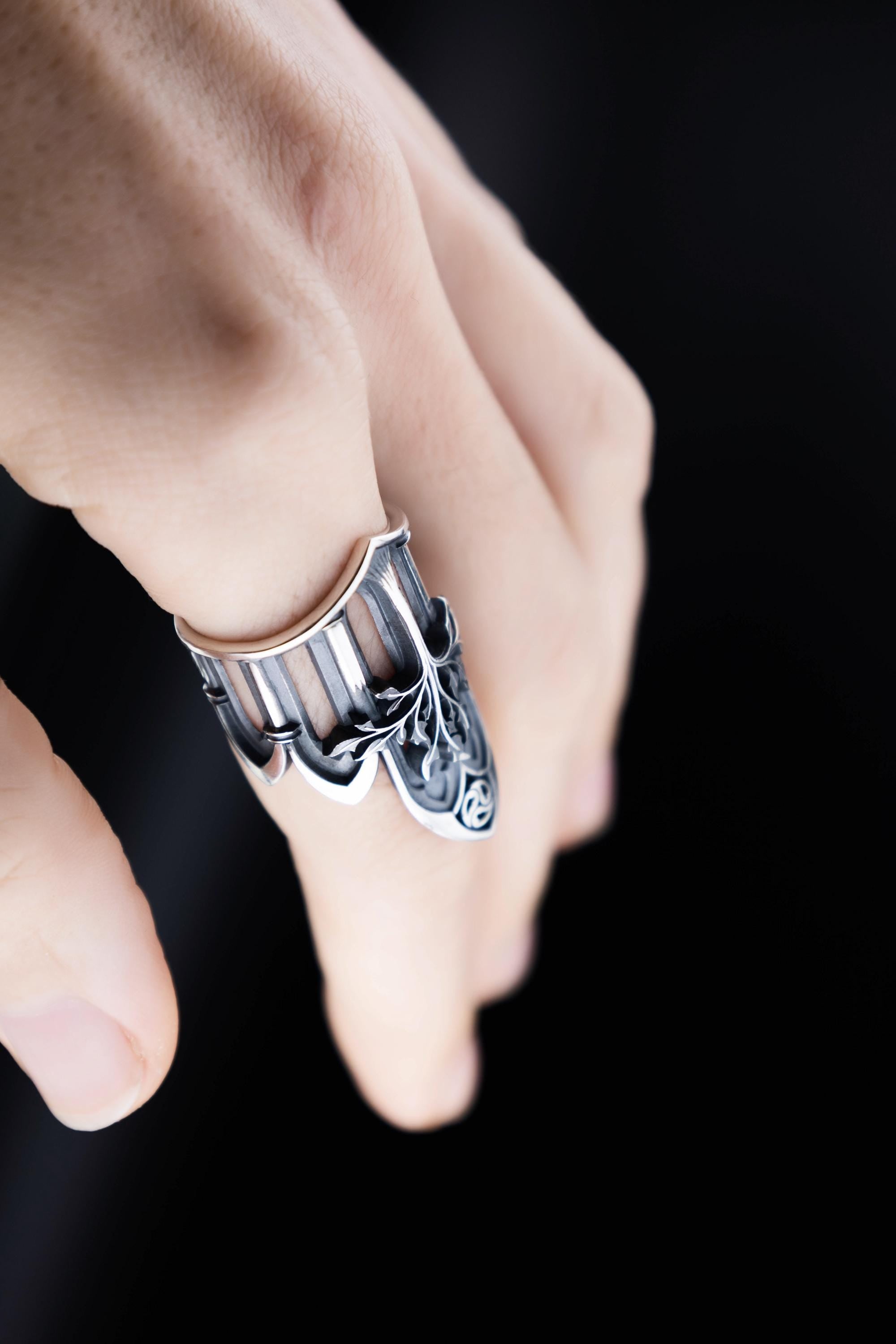 Hand wearing elven style sterling silver statement ring