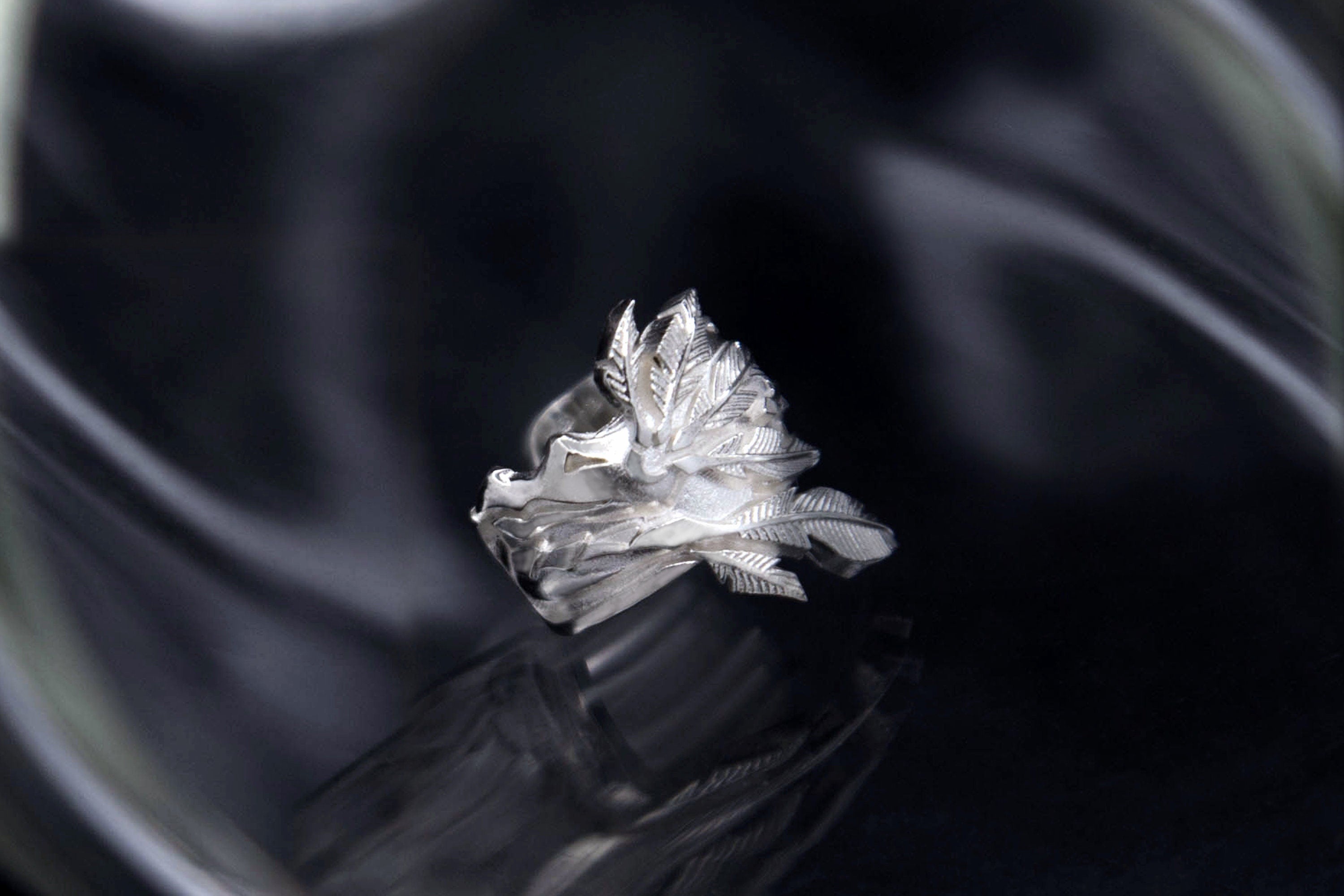 Detailed silver Wite Dragon ear cuff worn on ear