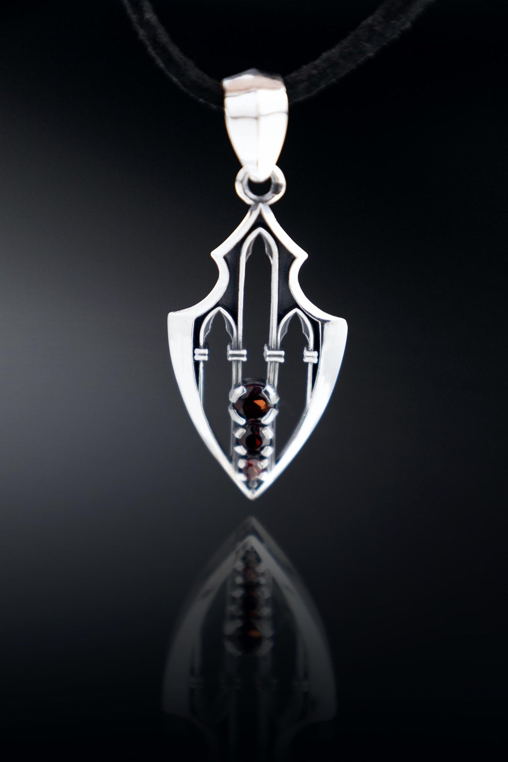 Gothic sterling silver pendant with garnets and arrowhead shape