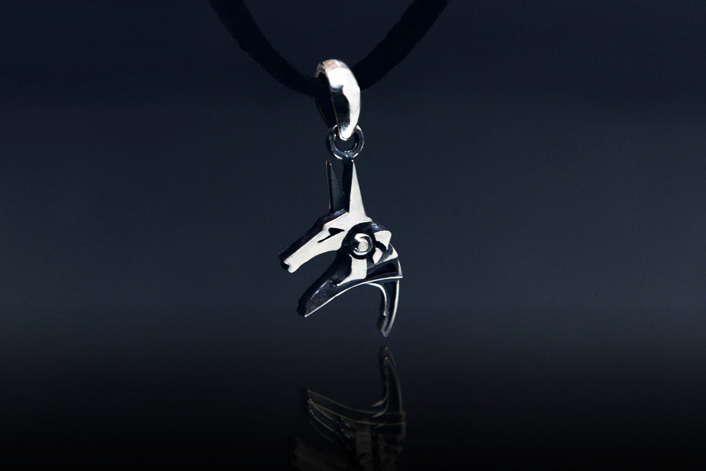 Sterling silver Anubis charm close-up, oxidized details