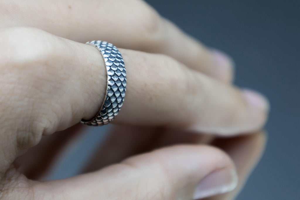 Dragon scale silver ring worn on hand