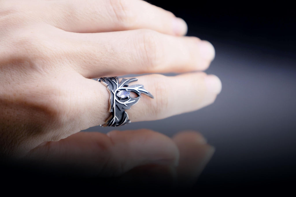 Moonstone wormwood ring worn on hand