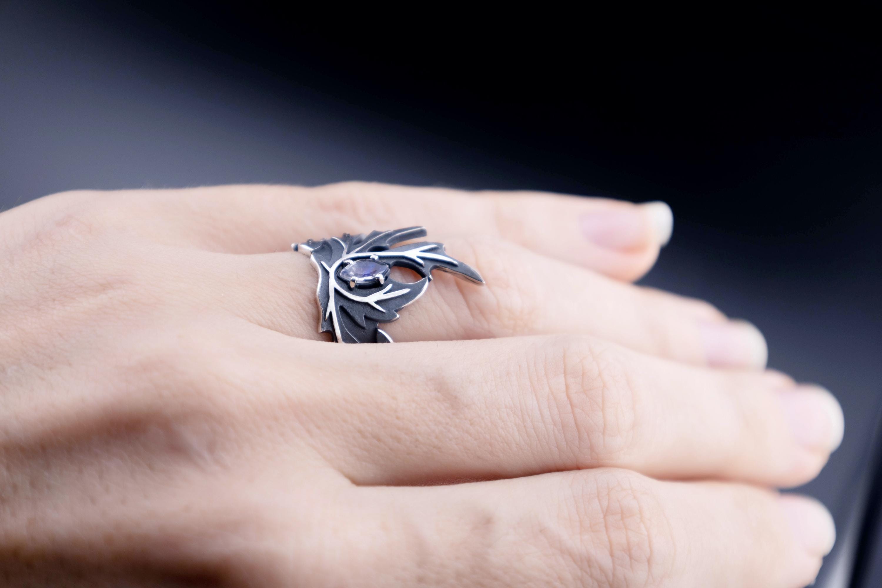 Moonstone wormwood ring worn on hand