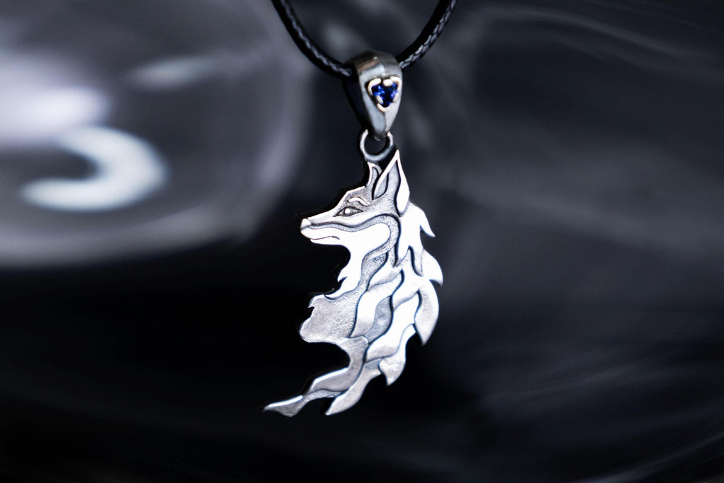 Sterling silver fox pendant with blue cubic zirconia