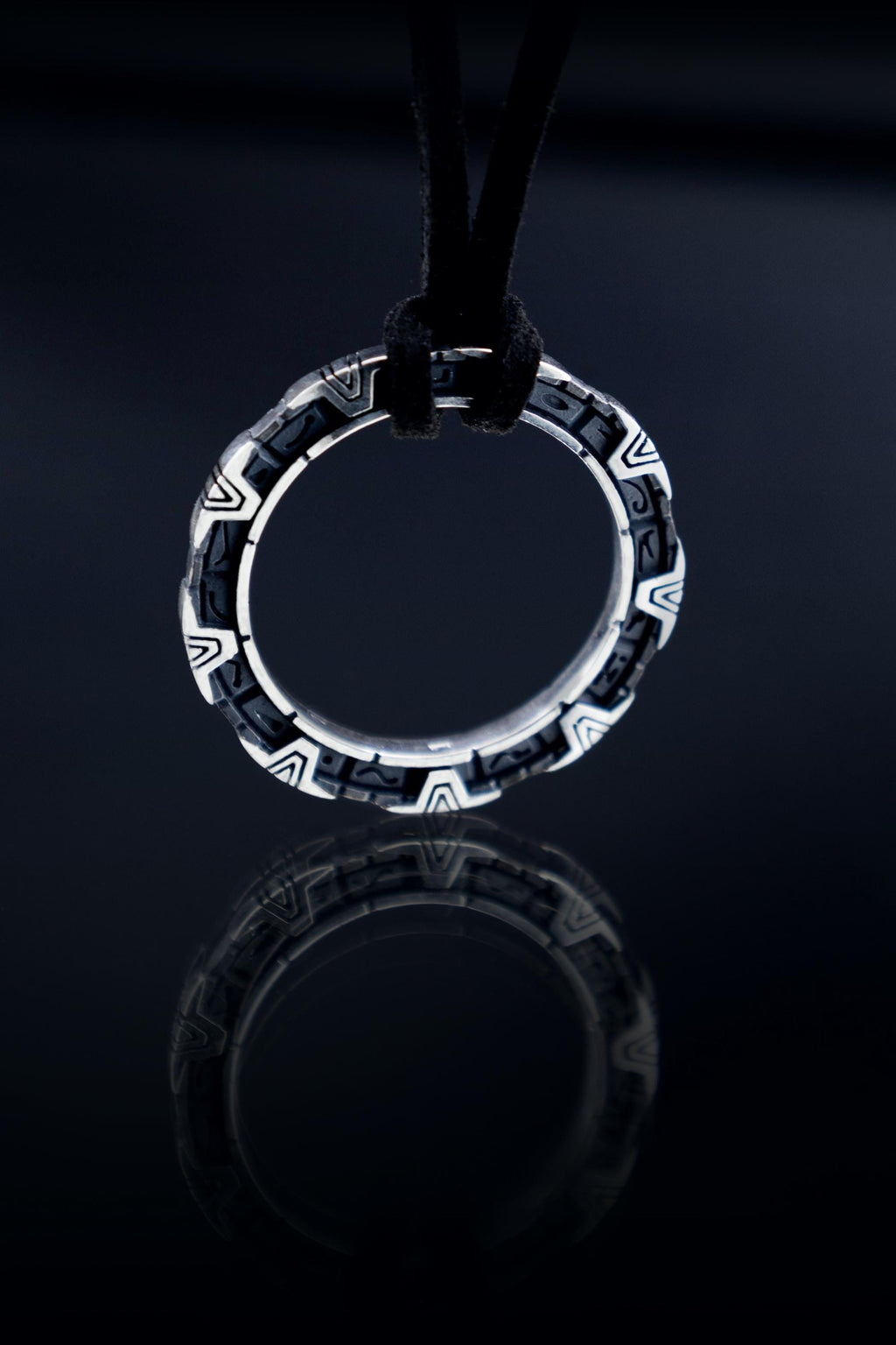 Round silver StarGate pendant inspired by 1994 movie