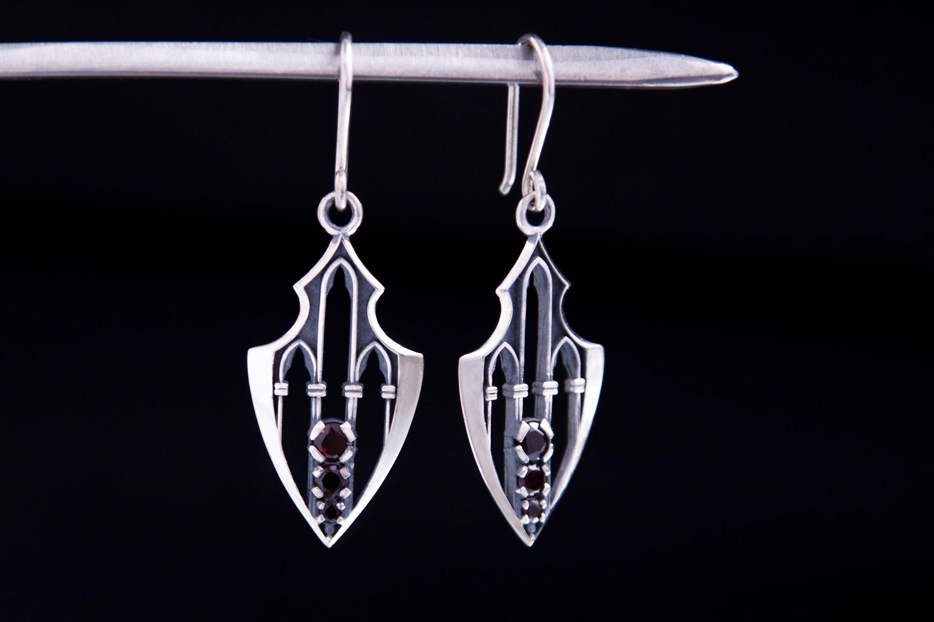 Sterling silver garnet cathedral earrings close-up showing architectural details