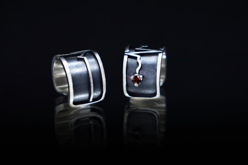 Minimalist silver ear cuff with red garnet accent