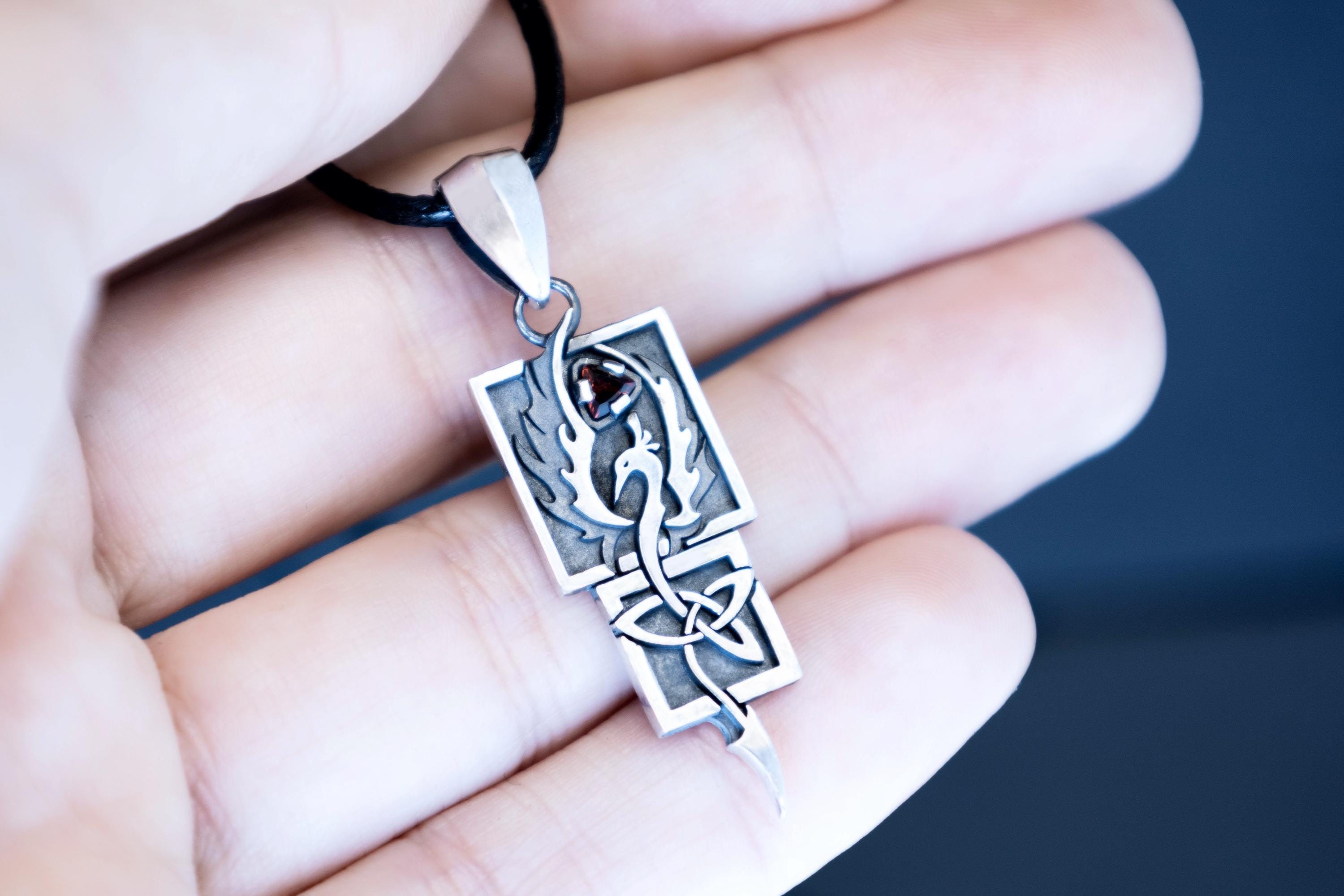 Mythical Phoenix jewelry in silver with natural garnet