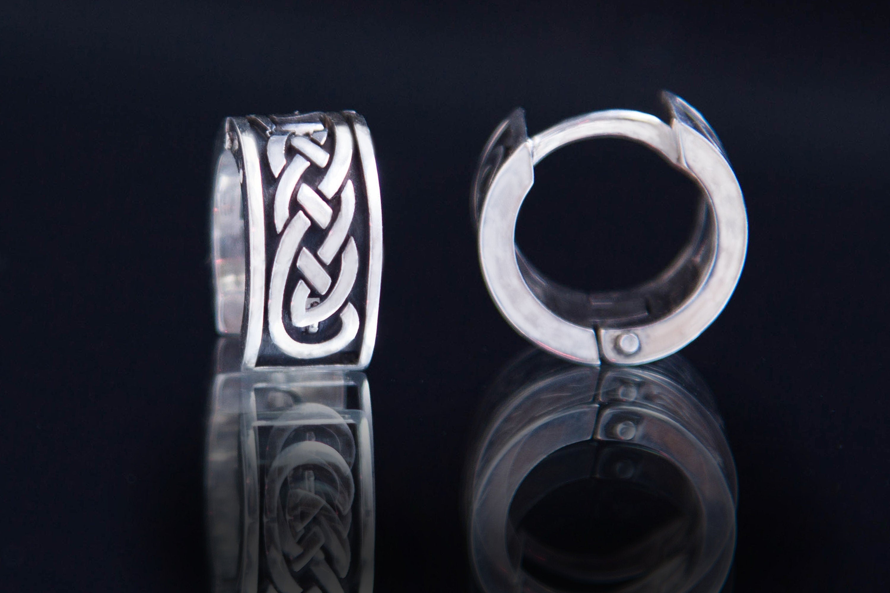 Sterling silver Celtic hoop earrings with classic knot pattern
