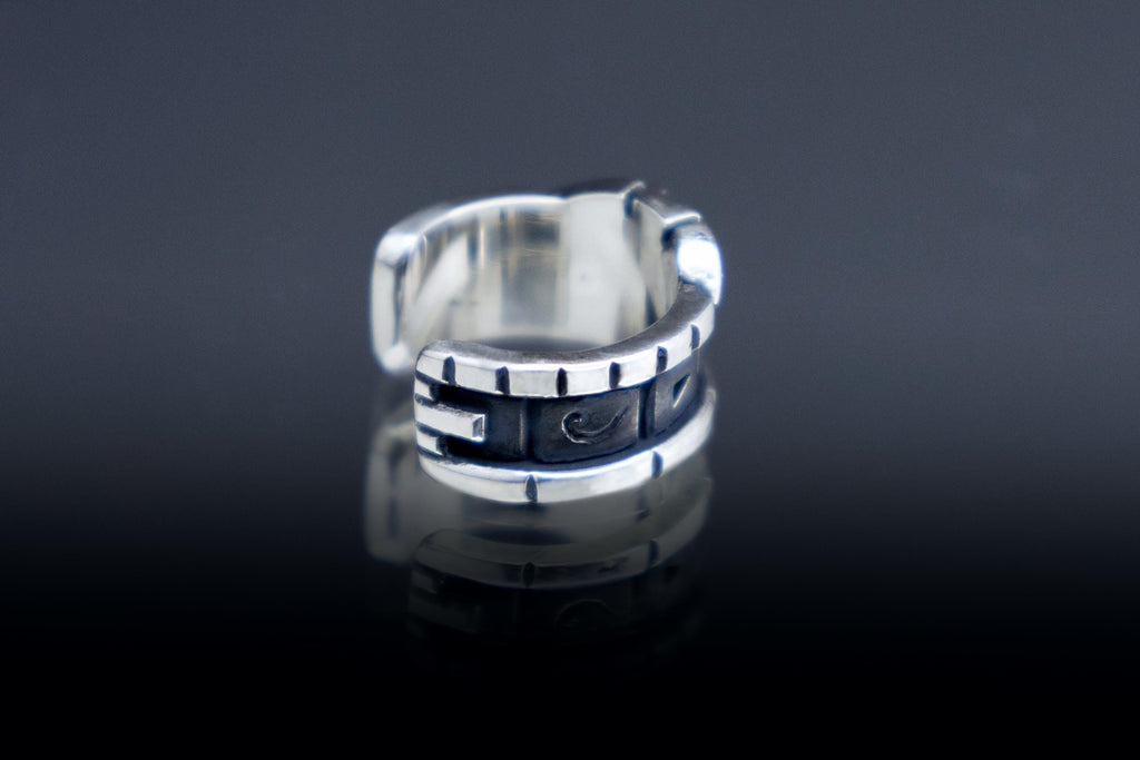 silver ear cuff with Star Gate glyphs